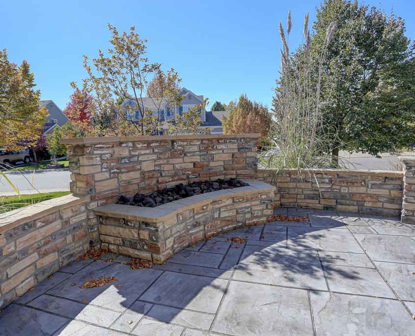 Baltimore Concrete Pros proudly create beautiful, custom secluded, residential front patio entertaining areas, including this large fire pit patio area, in Ellicott CIty, Fulton, Lutherville, Columbia, Ilchester, Scaggsville, Towson, Timonium, North Laurel, Mays Chapel and surrounding neighborhoods.