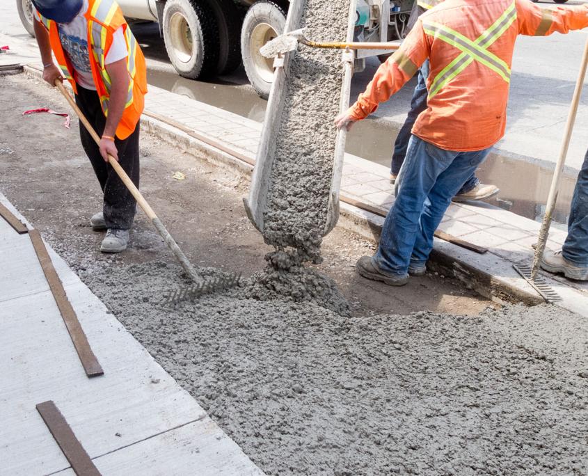 Baltimore Concrete Pros pouring cement during upgrade of sidewalk in commercial area of Ellicott CIty, Fulton, Lutherville, Columbia, Ilchester, Scaggsville, Towson, Timonium, North Laurel, Mays Chapel and surrounding.